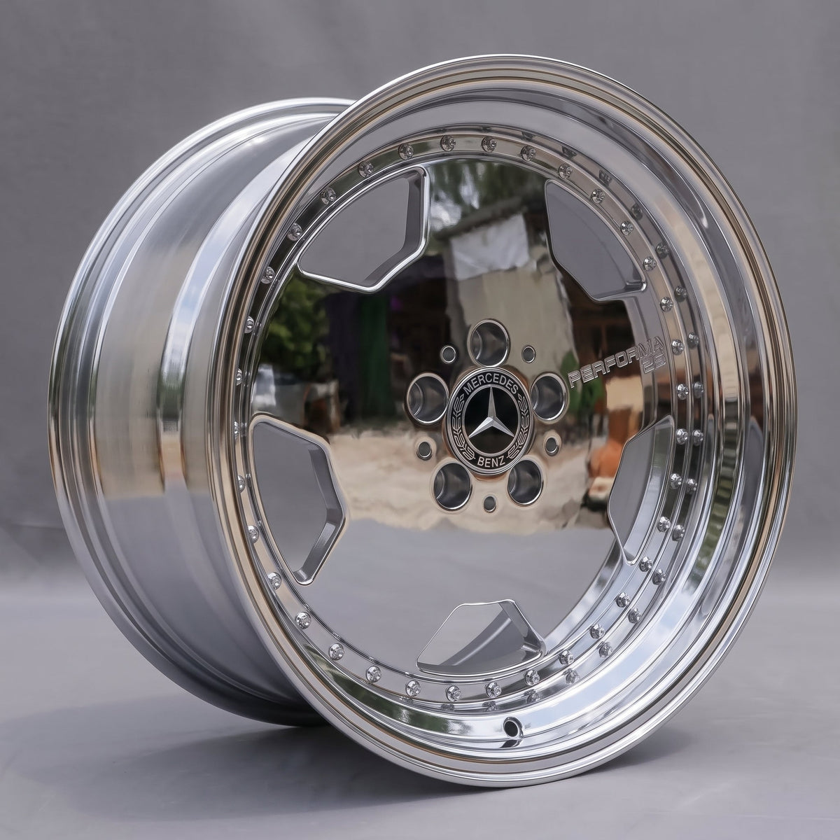18-inch chrome monoblock wheel, three-quarter angle showing the polished stepped lip